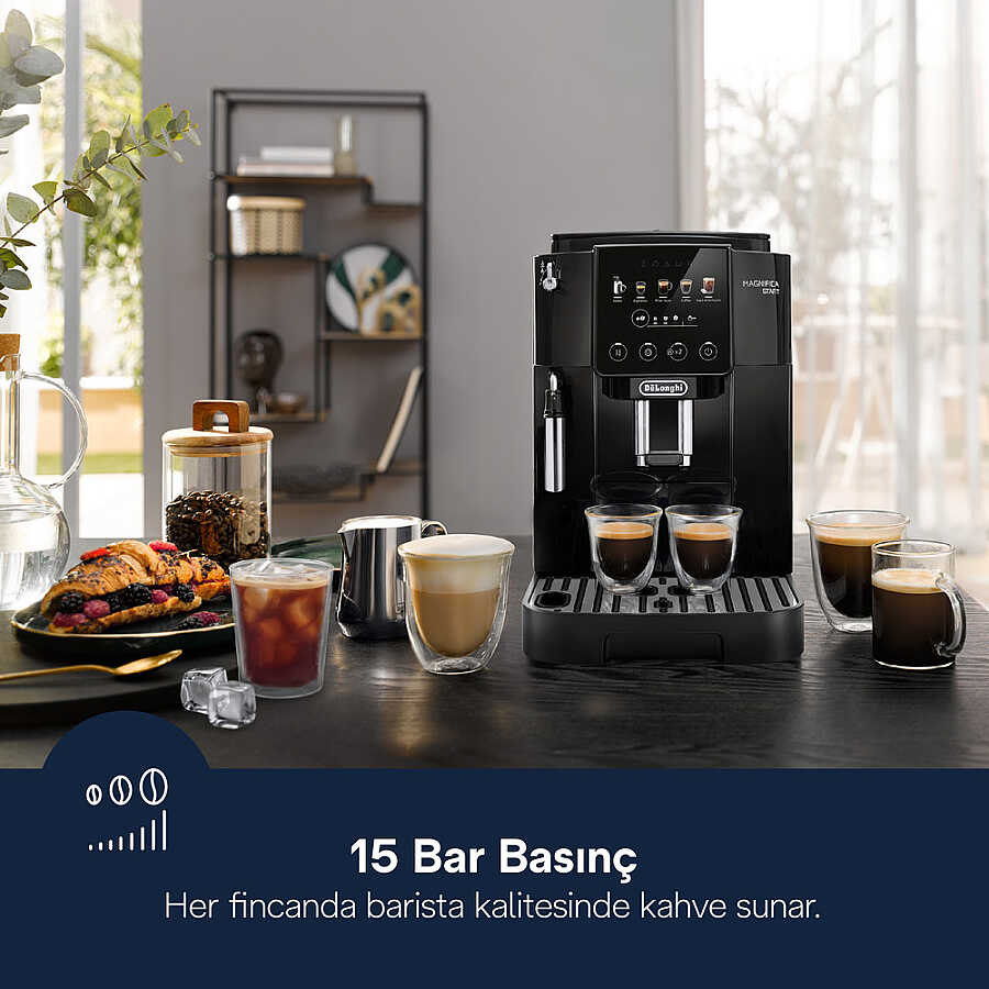 Espresso, cappuccino, buzlu kahve, kahve çekirdeği kavanozu ve hamur işleri olan masada siyah De'Longhi kahve makinesi.
