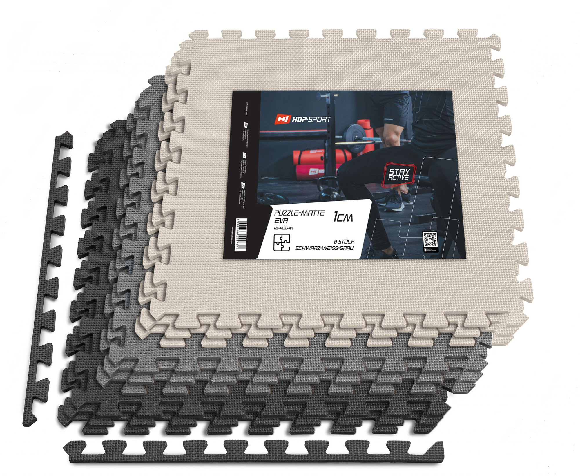 Stapel aus schwarzen, grauen und weißen EVA-Puzzlematten mit Produktverpackung oben.