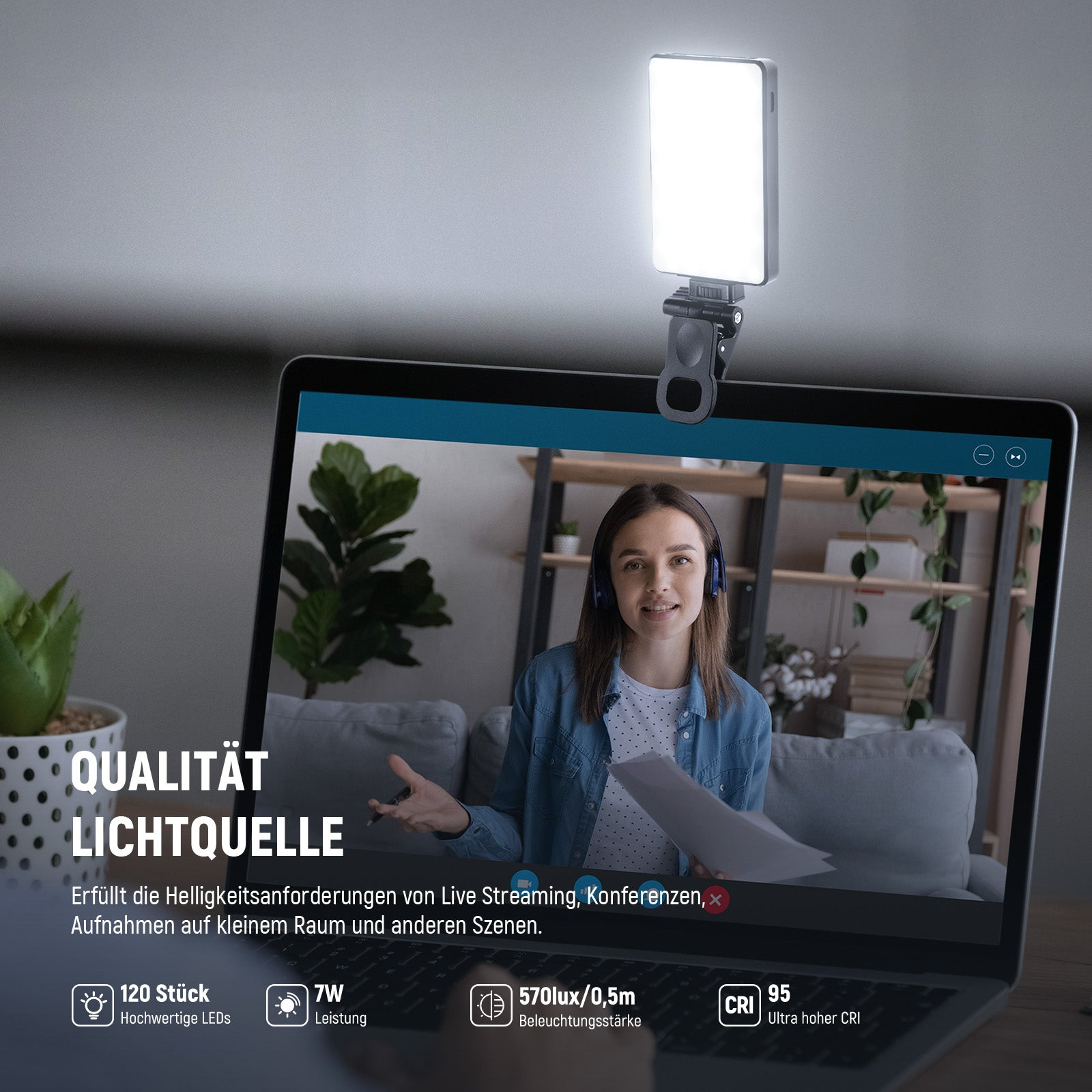 LED-Leuchte festgeklemmt am Laptop-Bildschirm, der eine Frau in einer Videokonferenz zeigt.