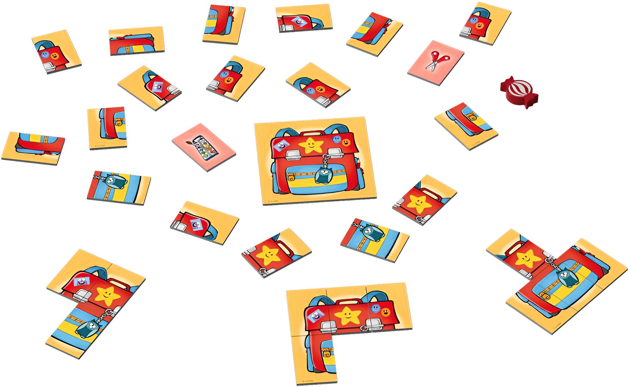 Ein Tisch voller bunter Puzzleteile mit roten Schulranzen, kleineren Karten und einem roten Bonbon.