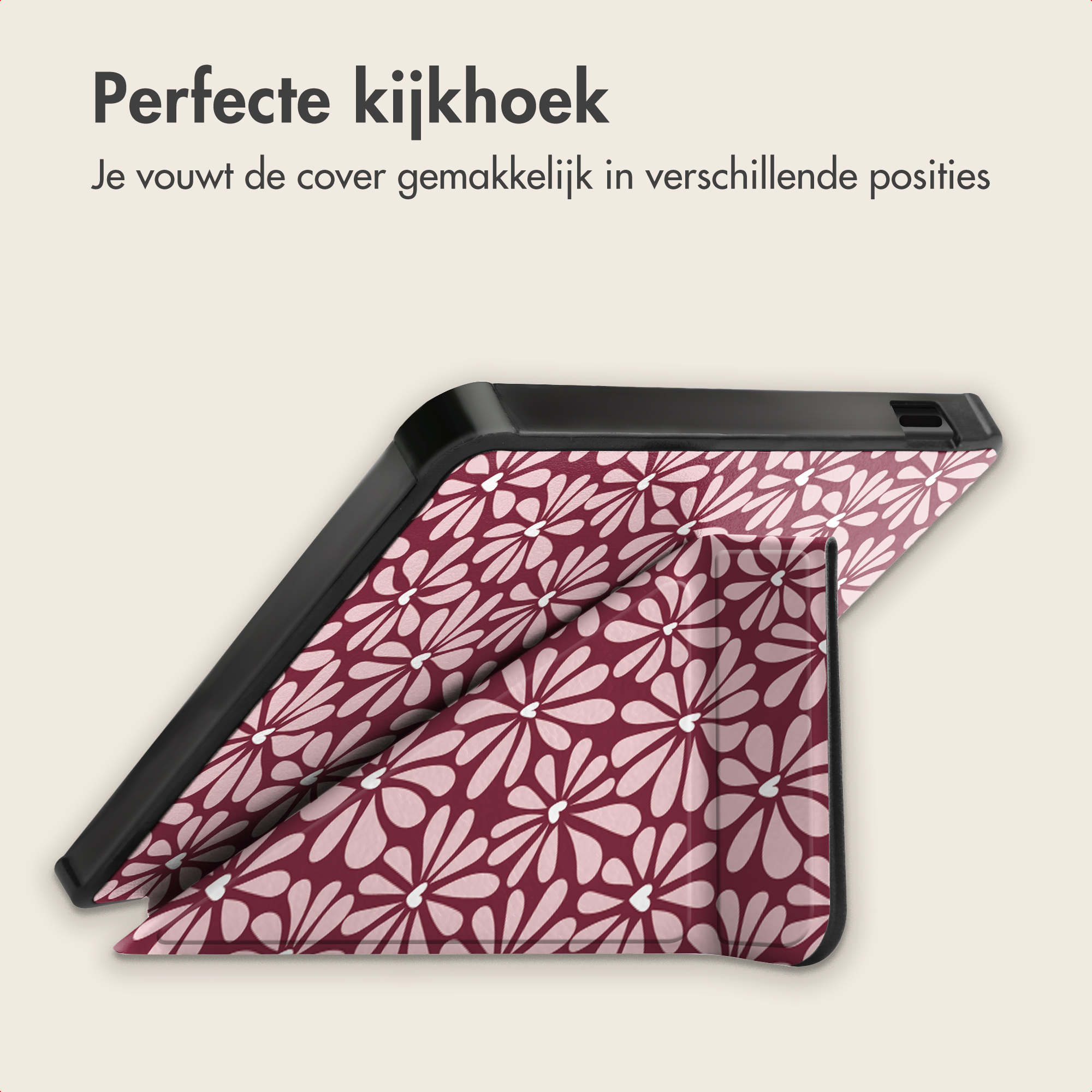 Een roze tablethouder met bloemenprint op een lichte achtergrond.