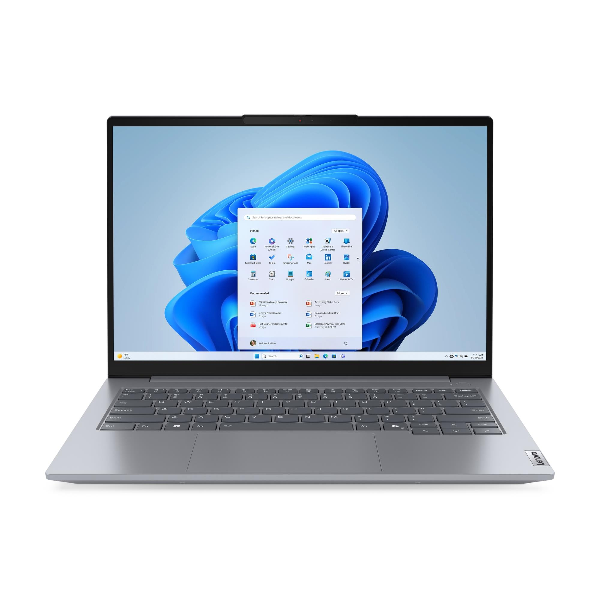 Siyah klavyeli gümüş renkli bir dizüstü bilgisayar Windows 11 başlangıç ​​ekranını gösteriyor.
