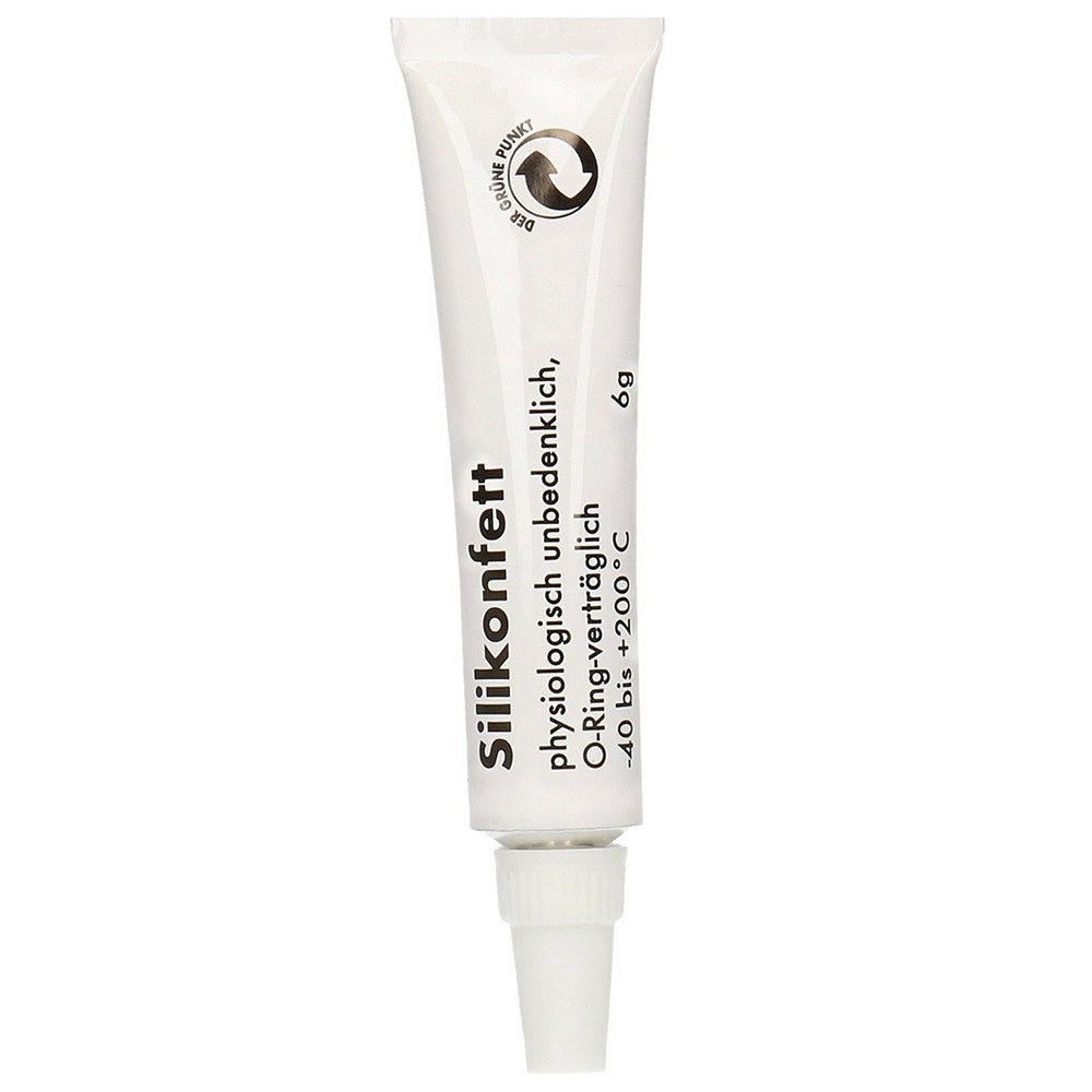 Un tubetto bianco di grasso al silicone con testo in tedesco e logo Punto Verde su sfondo bianco.