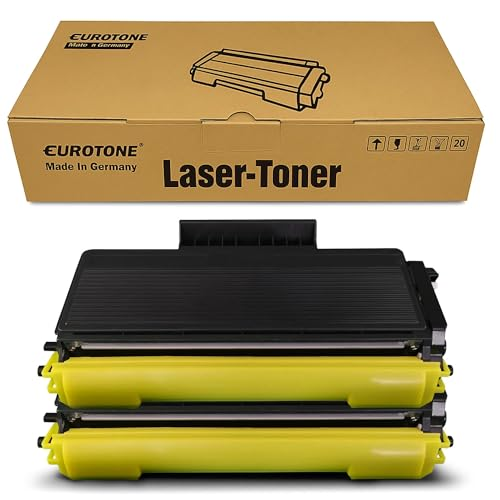 Zwei schwarz-gelbe Lasertoner-Kartuschen vor einer braunen Eurotone-Box.