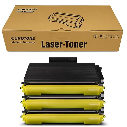 Eurotone Lasertoner-Verpackung über einem Stapel aus drei schwarzen und gelben Tonerkartuschen.