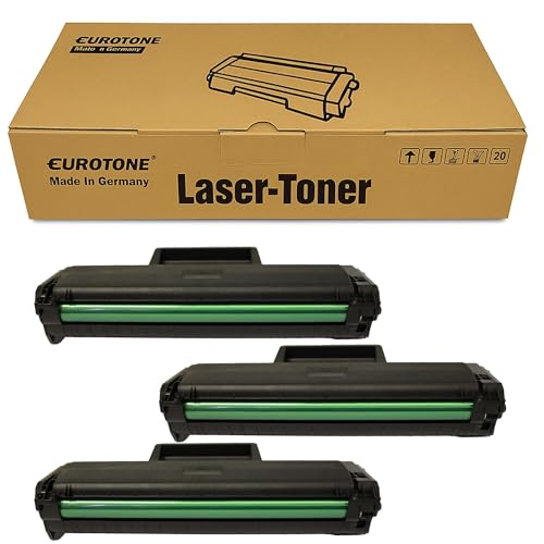 Eine Eurotone Laser-Toner Box und drei schwarze Toner-Kartuschen mit grünen Rollen.