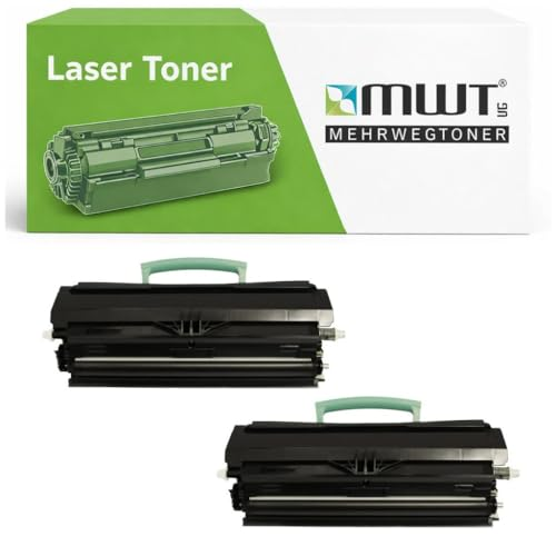 Zwei schwarze Lasertoner mit grünem Griff vor einer weiß-grünen MWT-Verpackung.