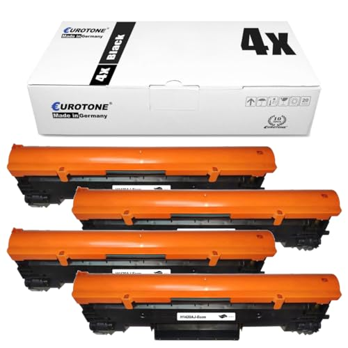 Eine weiße Schachtel mit der Aufschrift 4x Black und vier orange-schwarze Tonerkassetten davor.