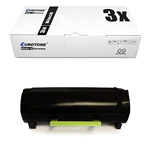 Eine weiße Box mit Aufschrift und ein schwarzer Toner mit grünem Griff.