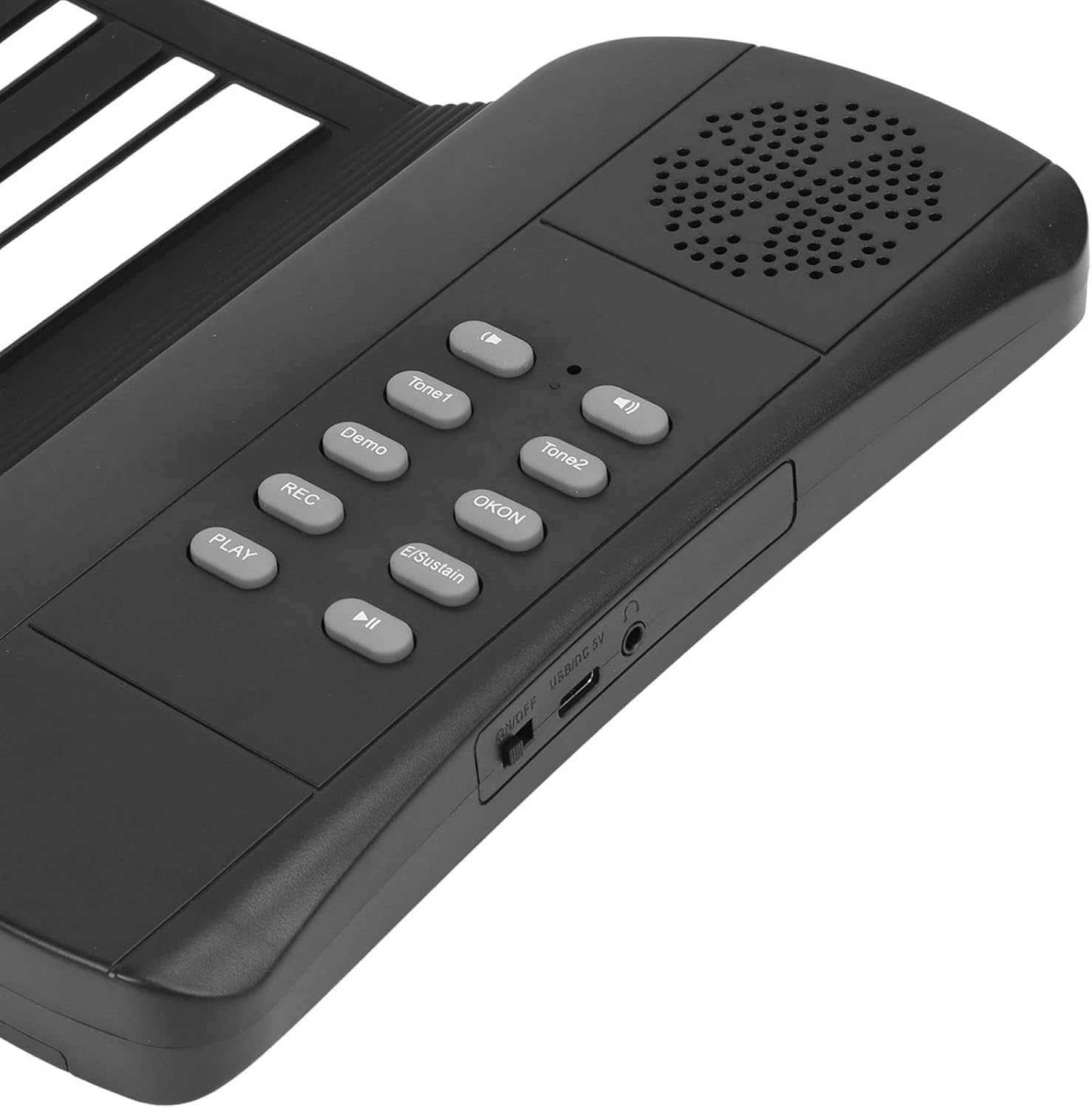 Schwarzes elektronisches Keyboard mit grauen Bedientasten und einem Lautsprecher auf der rechten Seite.