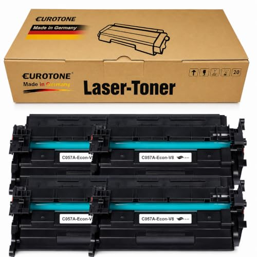 Vier schwarze Laser-Toner-Kassetten mit blauen Walzen und ein Eurotone-Karton.