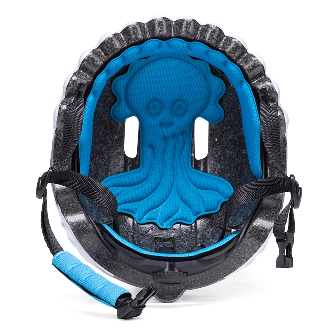 Vista interna di un casco per bambini con schiuma grigia, cinghie nere e un'imbottitura blu a polpo.