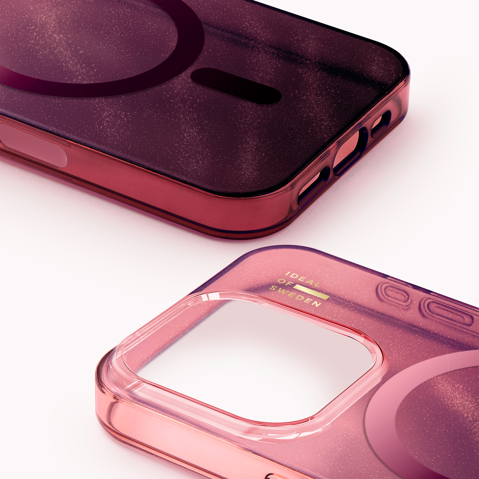 Zwei glänzende lila-rosa Glitzer-Handyhüllen auf weißem Hintergrund.