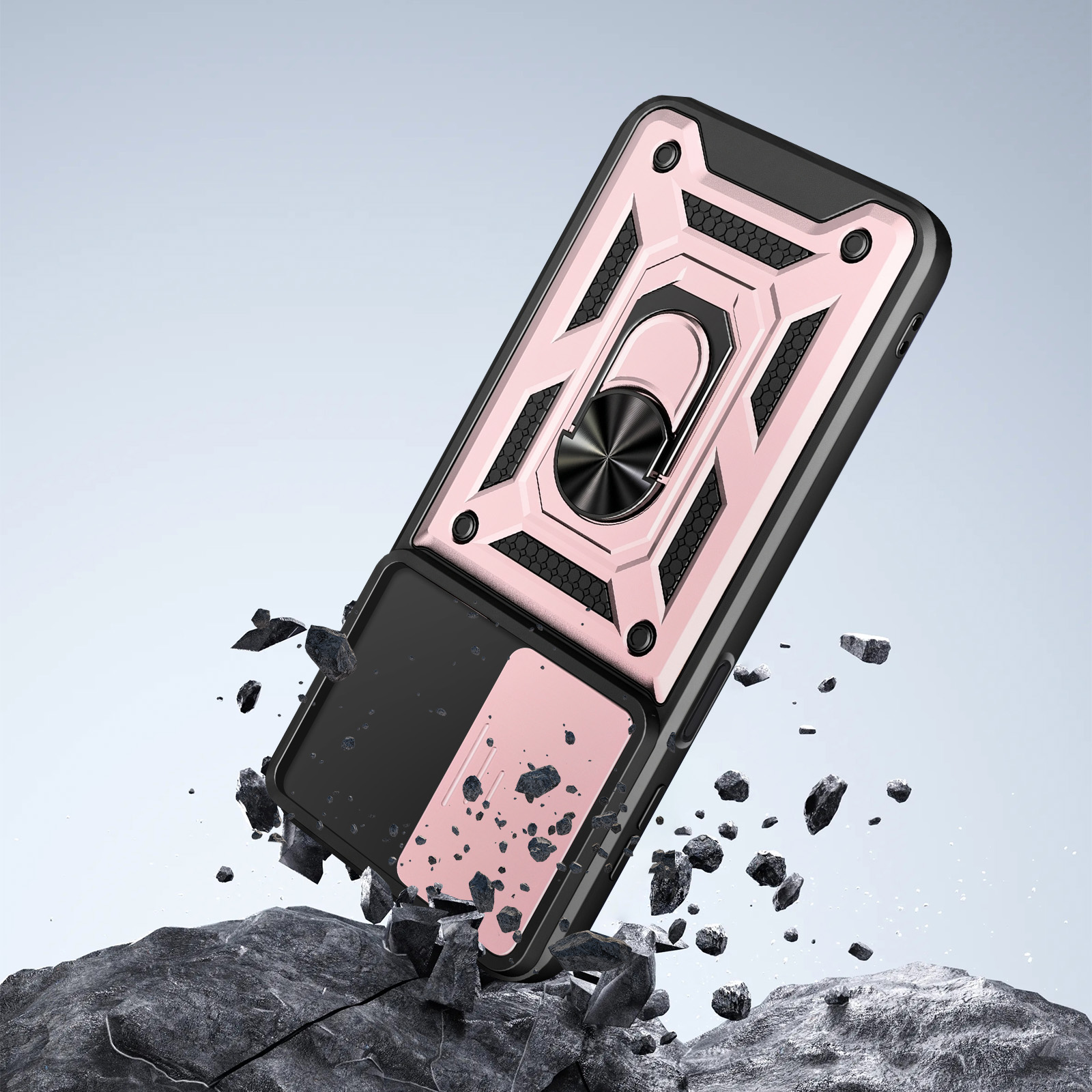 Robuste Handyhülle in Rosa und Schwarz mit Ringhalterung schlägt auf graue Felsen auf und wirbelt Steine auf.