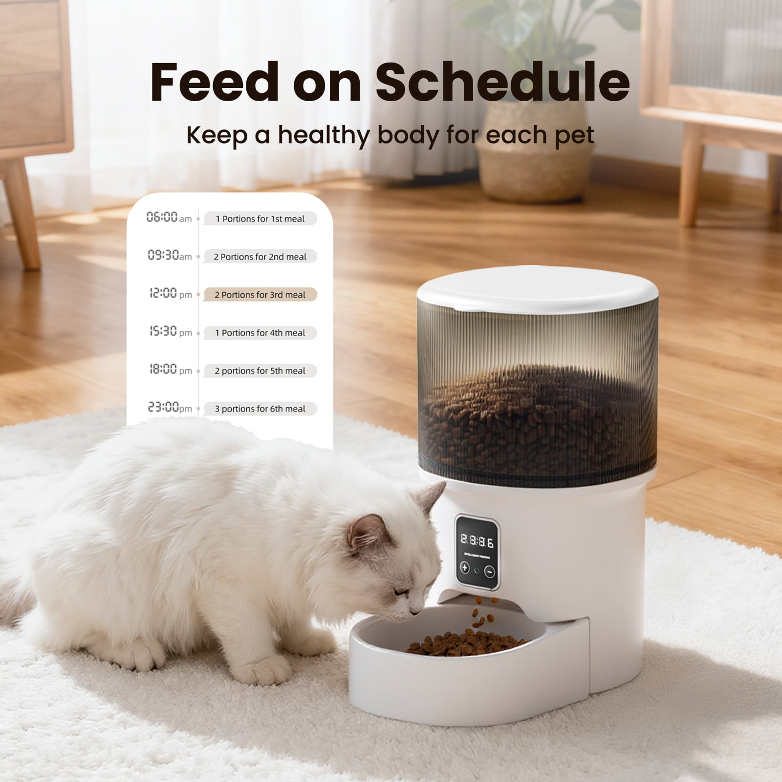 Eine weiße Katze frisst aus einem automatischen Futterautomaten auf einem Teppich.