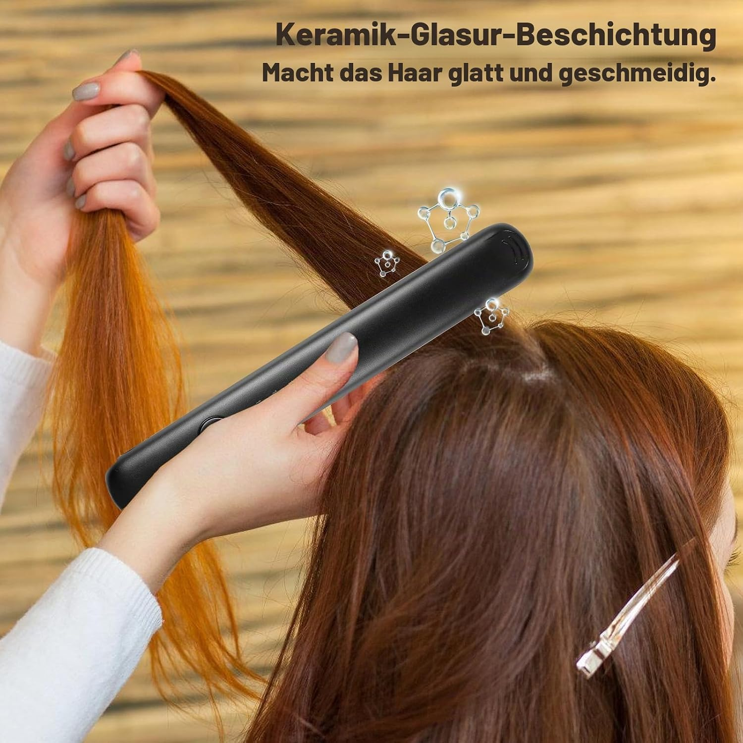 Eine Person benutzt ein schwarzes Glätteisen für langes braunes Haar, mit deutschem Text oben.