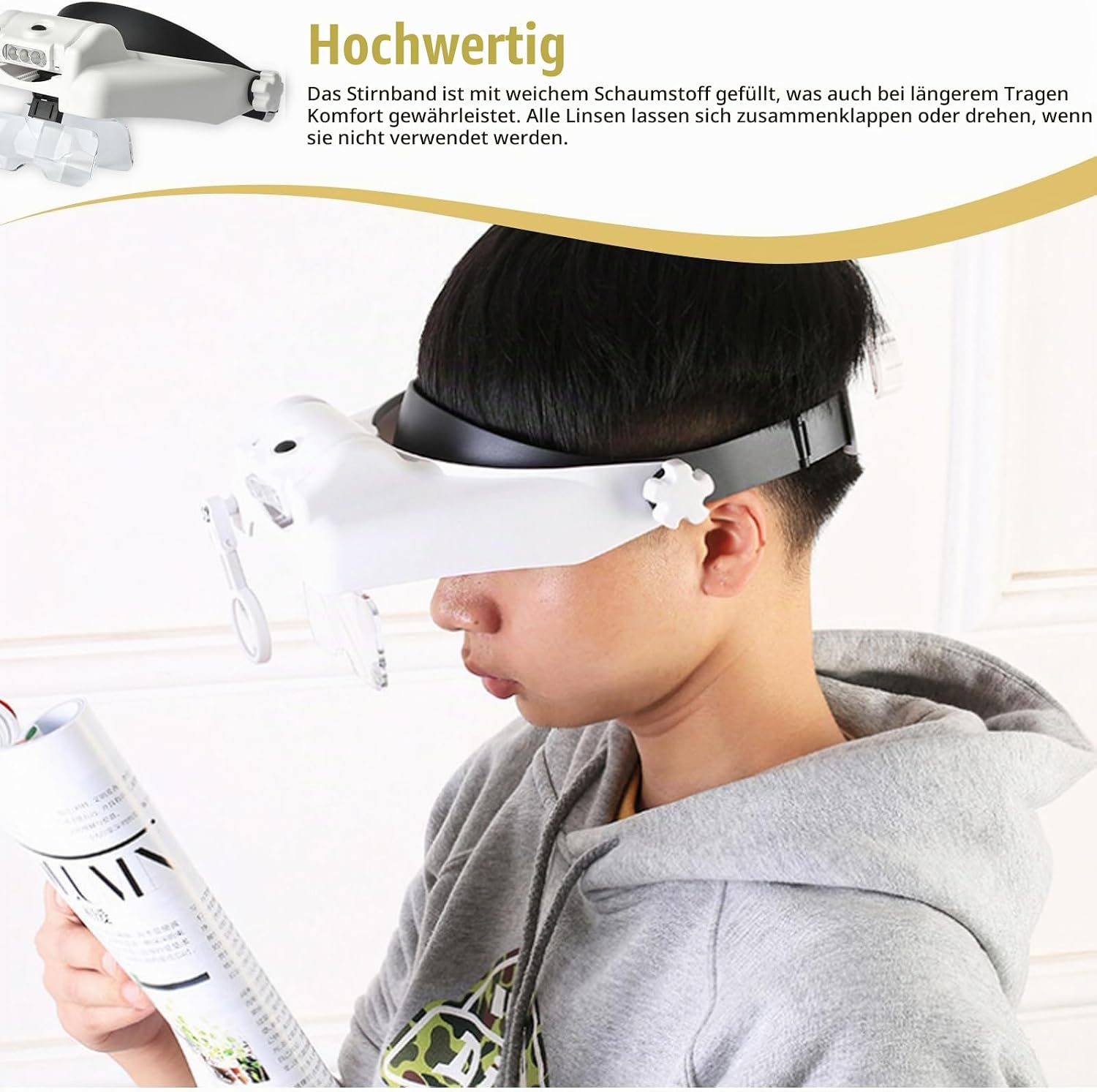 Junge liest mit einer weißen LED-Kopfbandlupe ein Magazin.