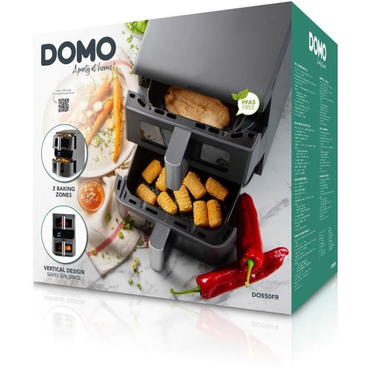Emballage de la friteuse sans huile DOMO à double zone avec viande et croquettes près de poivrons.