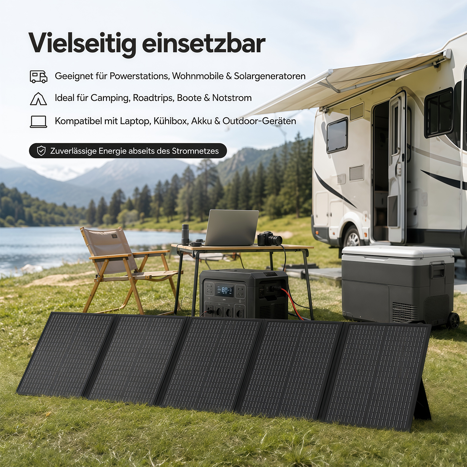 Solarpanel, Powerstation und Kühlbox vor einem Wohnmobil am See mit Bergen im Hintergrund.