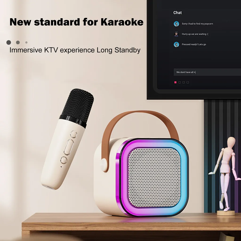 Ein weißer Karaoke-Mikrofon und ein tragbarer Lautsprecher mit buntem LED-Licht und braunem Griff auf einem Tisch.