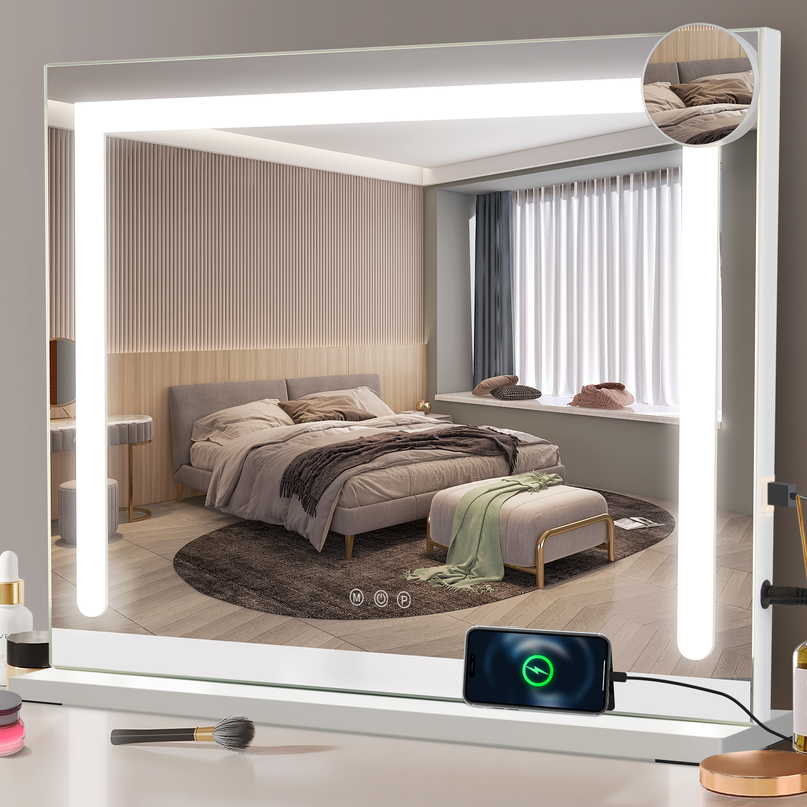 Gran espejo de maquillaje iluminado que refleja un dormitorio, con cosméticos y teléfono en la base.