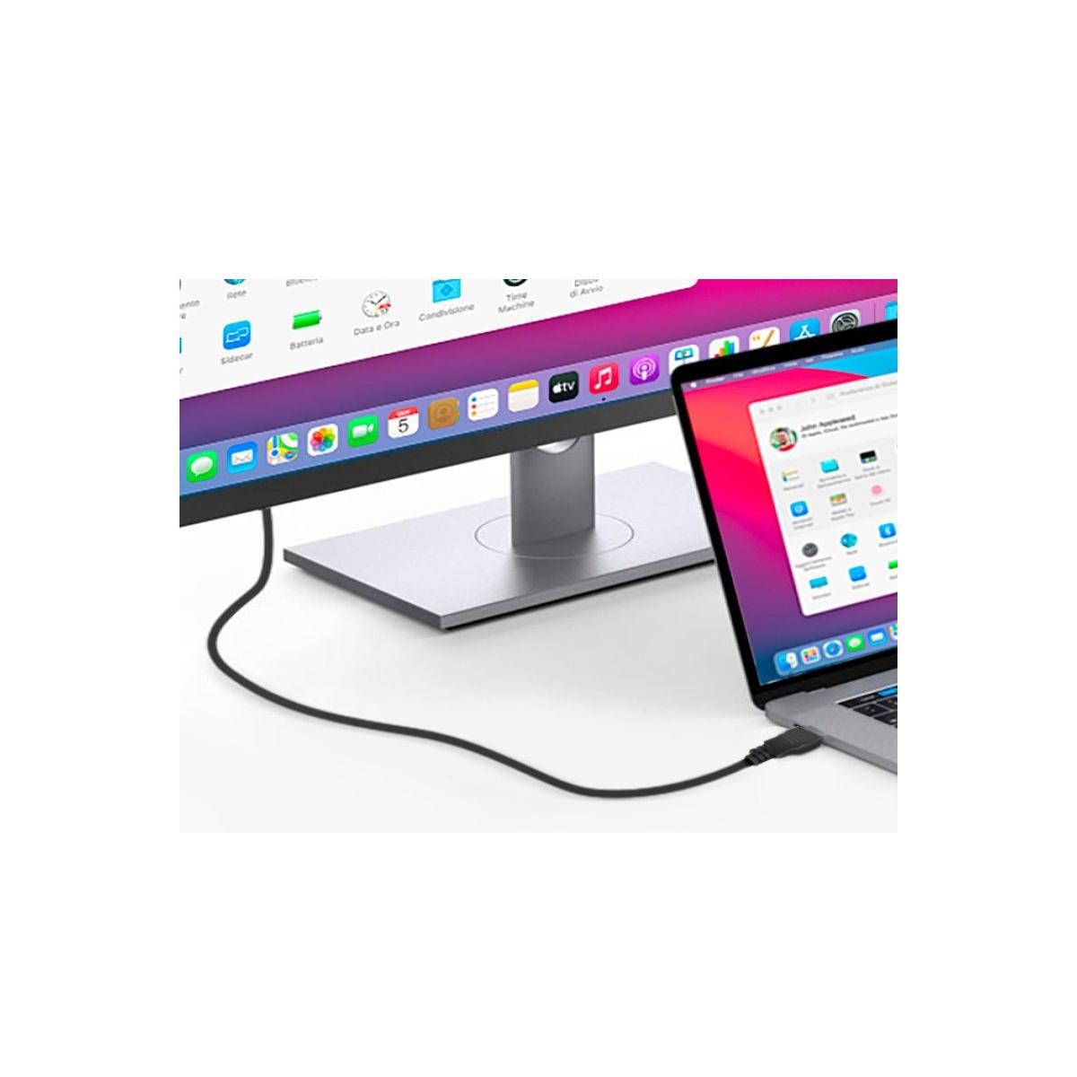 Un ordenador portátil está conectado a un monitor externo mediante un cable.