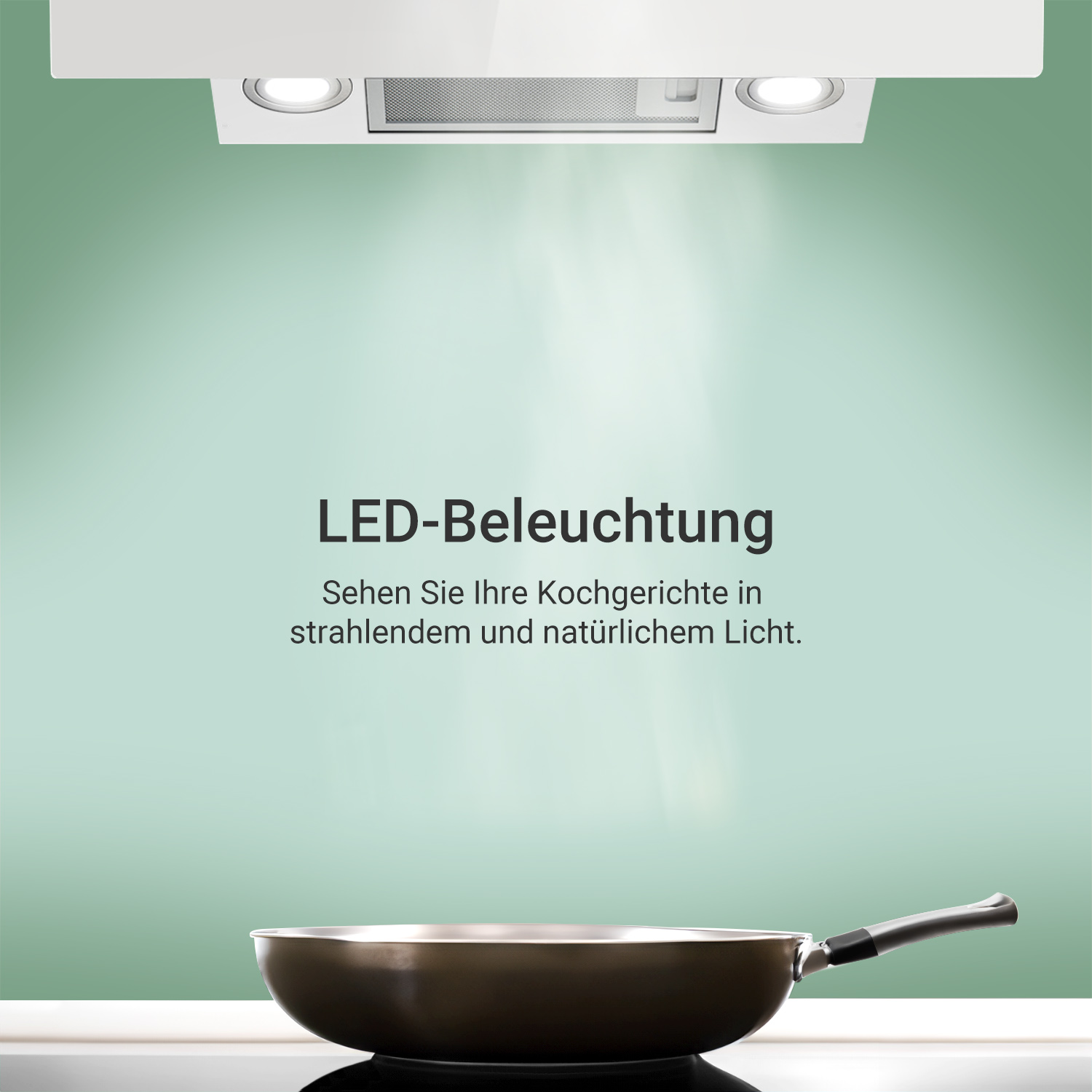 Una cappa aspirante con illuminazione LED sopra una padella su fondo verde.