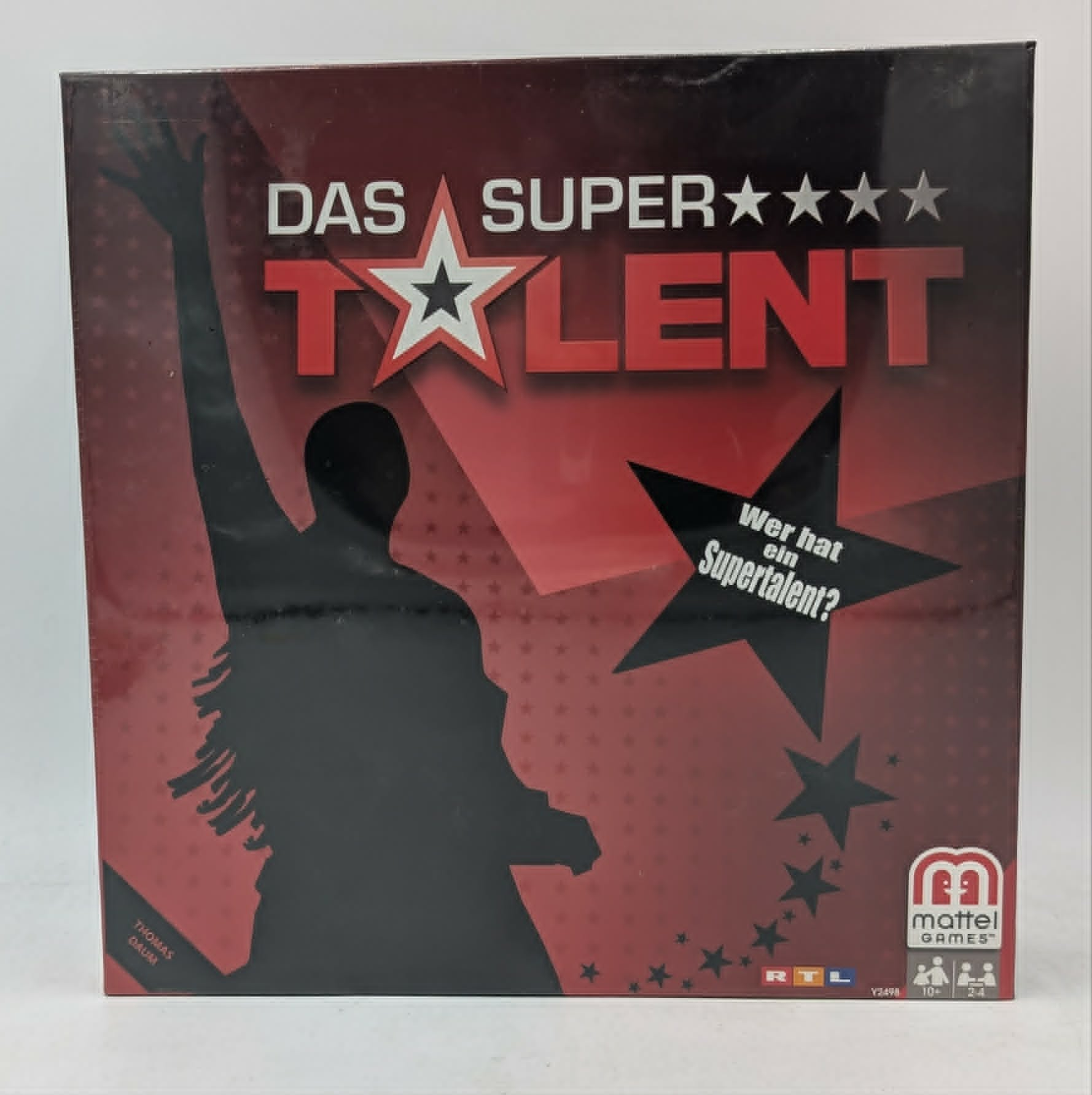 Die Box des Brettspiels Das Supertalent zeigt eine schwarze Silhouette einer Person vor rotem Hintergrund.