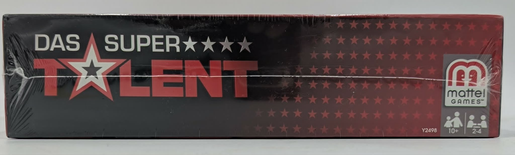 Verpackung von Das Supertalent von Mattel Games mit rotem und weißem Logo, Sternen und Altersfreigabe ab 10 Jahren.