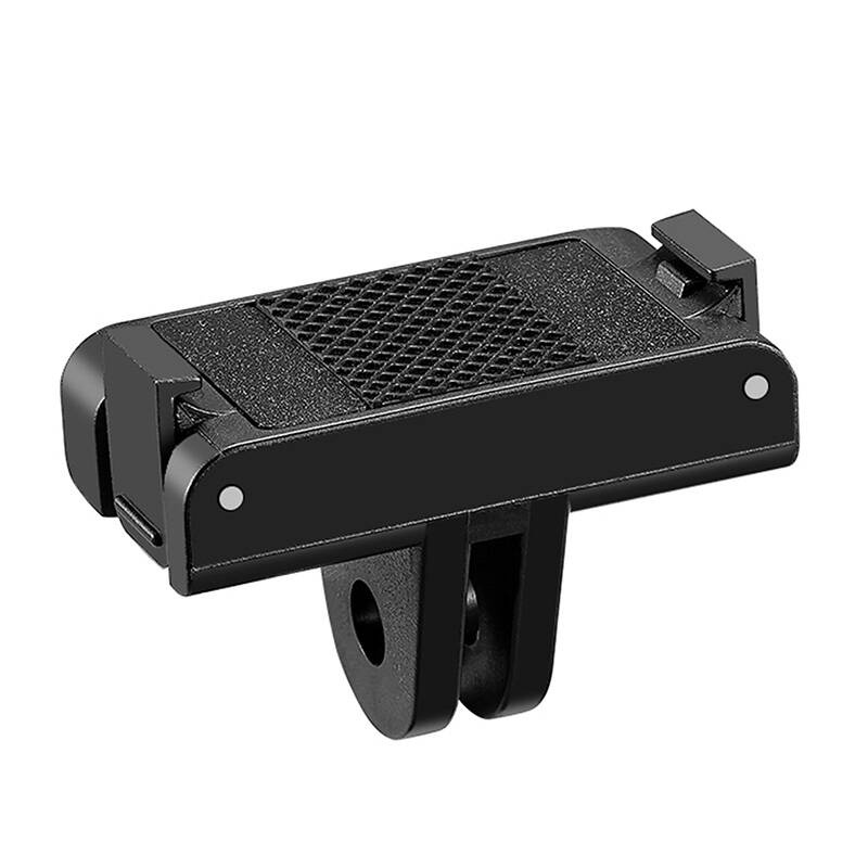 Supporto per fotocamera in plastica nera con cuscinetto testurizzato su sfondo bianco.