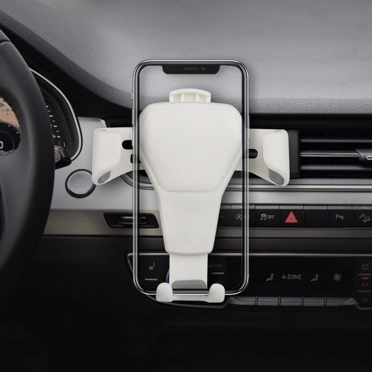 Un supporto bianco per smartphone è montato sulle bocchette dell'aria della plancia di un'auto.