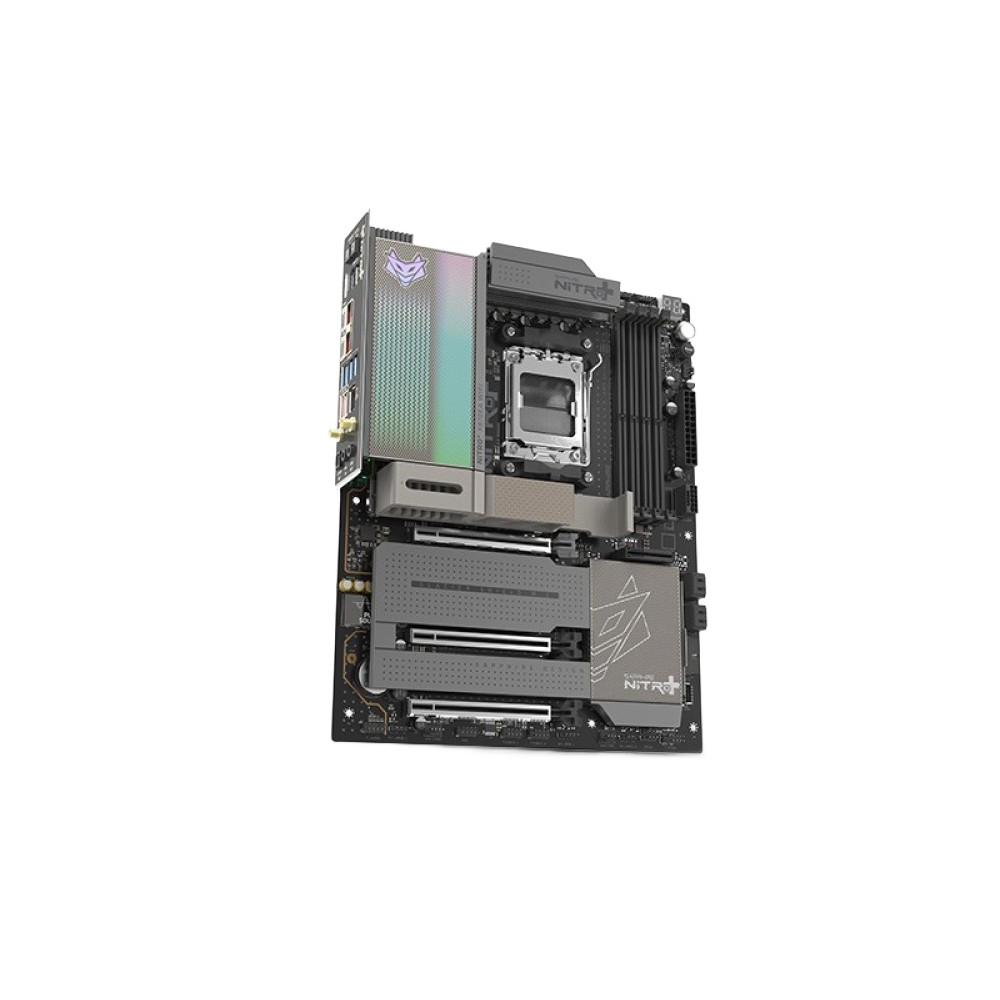 Szczegółowa płyta główna komputera z szarymi radiatorami i gniazdami PCIe na czarnym laminacie.