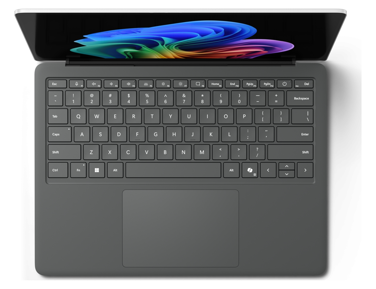 Vista dall'alto di un laptop grigio scuro con schermo colorato e tastiera QWERTY su sfondo bianco.