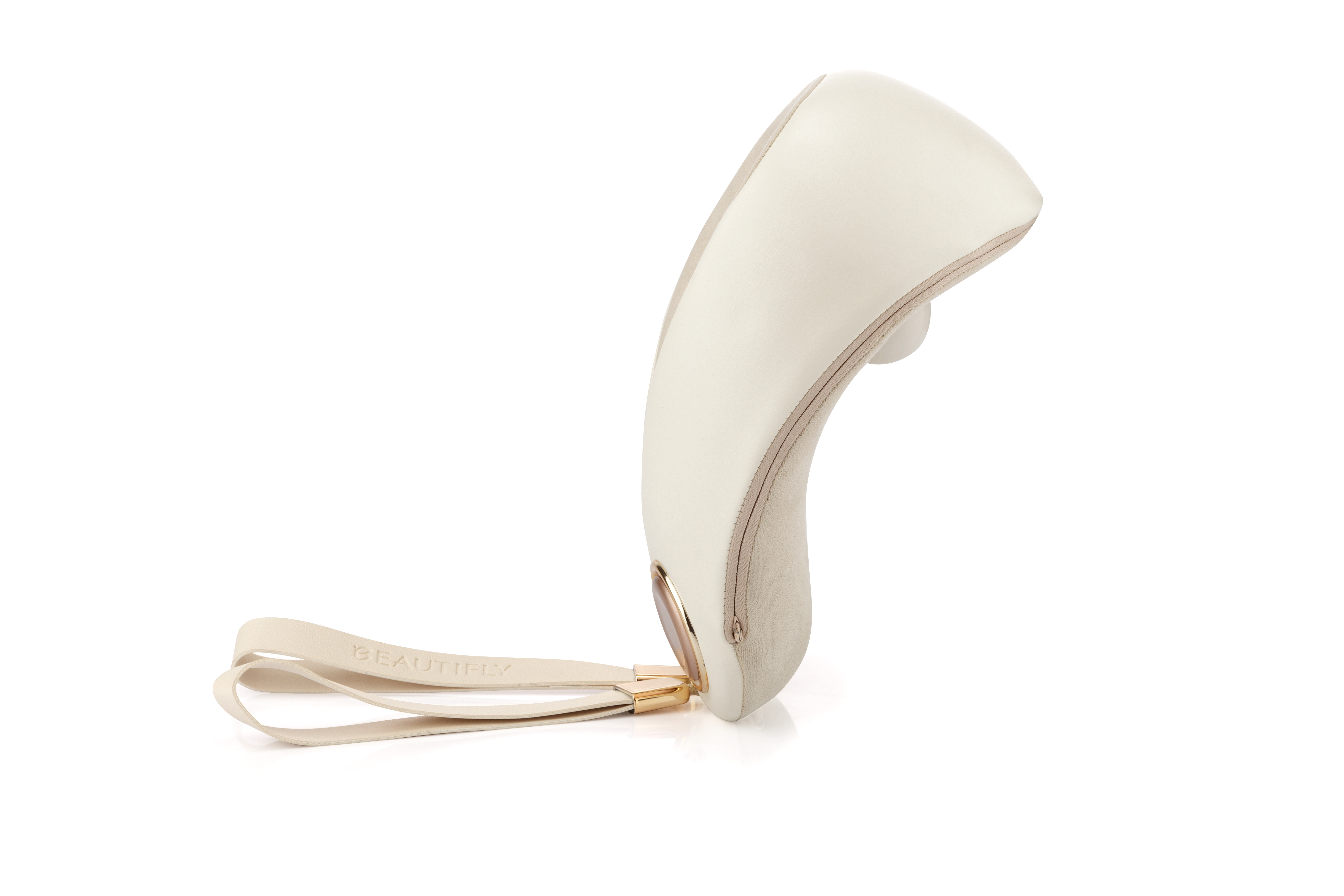 Ein beiges, ergonomisches Gesichtsreinigungsgerät mit einer Handschlaufe steht auf weißem Grund.