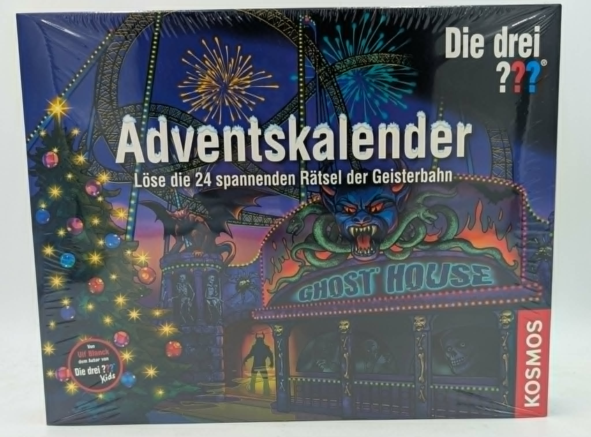 Ein Kosmos Adventskalender mit dem Thema Die drei ???, der eine Geisterbahn bei Nacht zeigt.