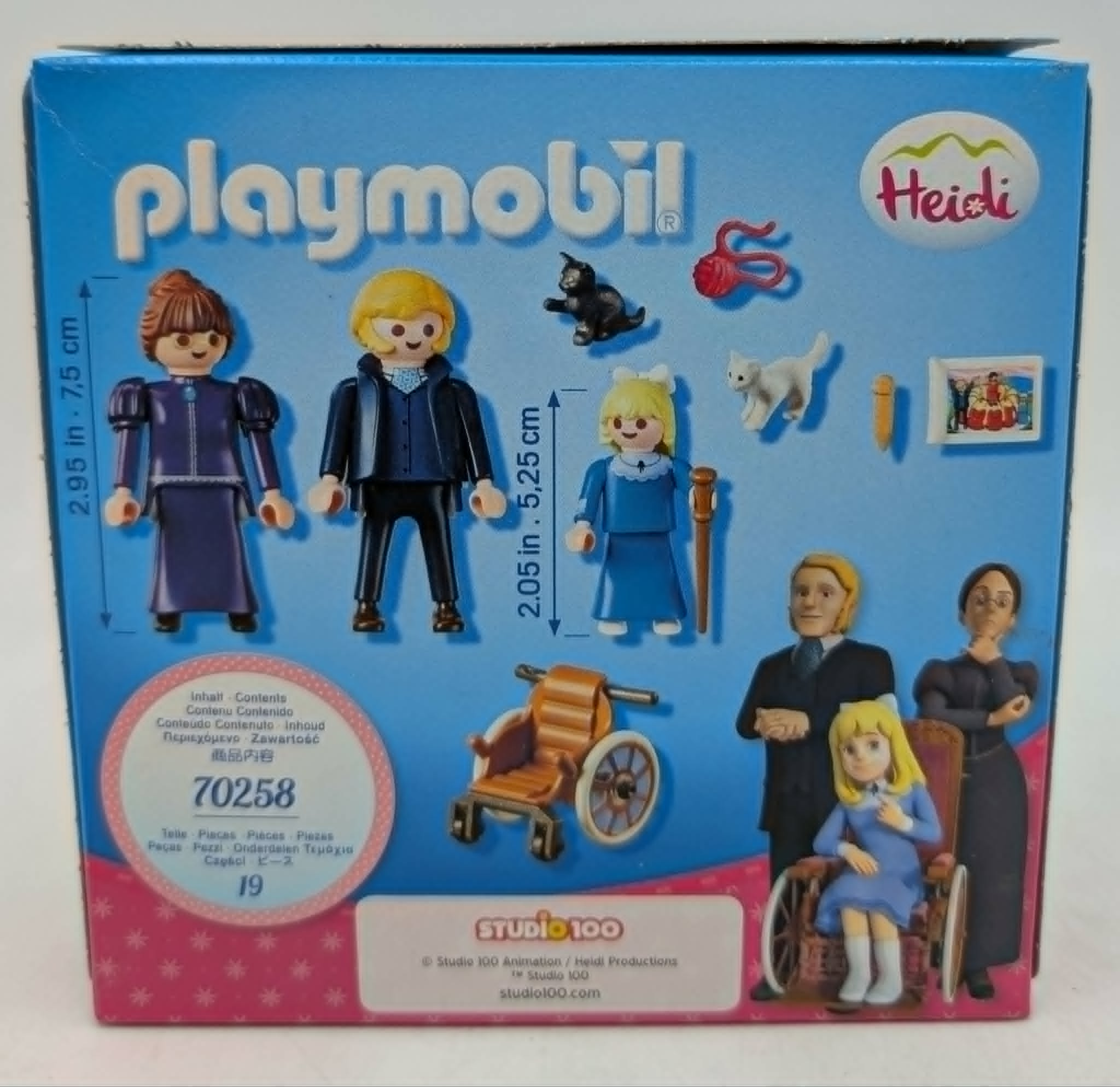 Blauer Playmobil Heidi Set Karton mit Figuren, Rollstuhl, Katzen und Seriencharakteren.