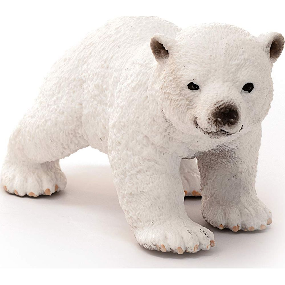 Eine kleine weiße Eisbärenfigur steht auf einem weißen Hintergrund.