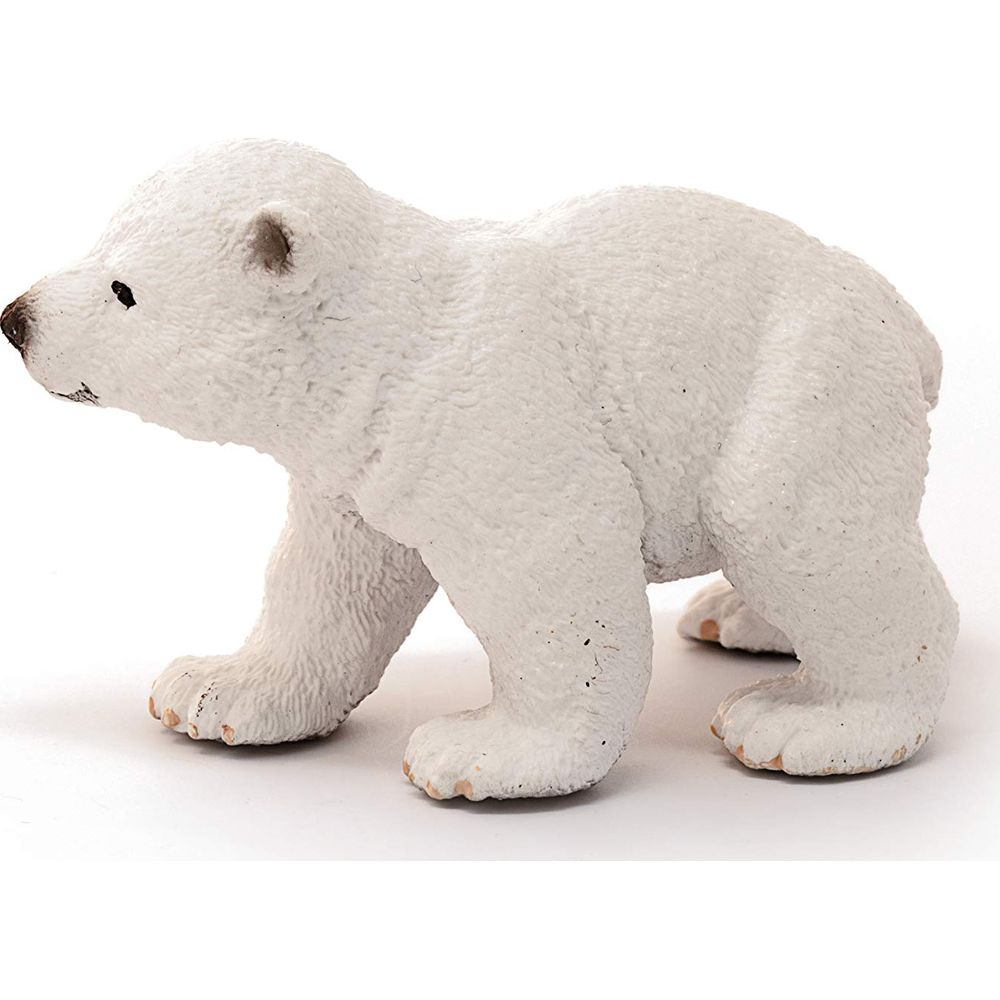 Eine kleine weiße Eisbärenfigur auf weißem Hintergrund.