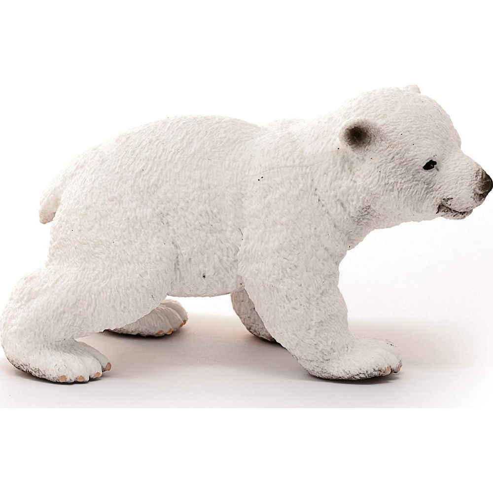 Eine weiße Eisbärenfigur auf weißem Hintergrund.