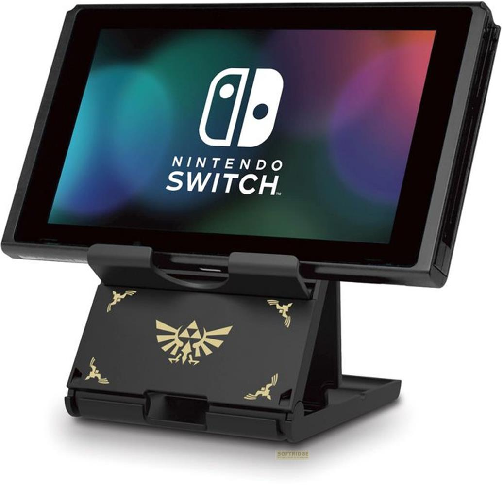 Eine Nintendo Switch Konsole ruht auf einem schwarzen Ständer mit goldenen Zelda-Symbolen.