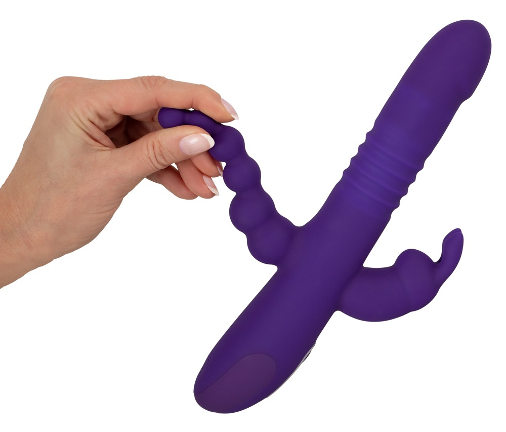 Eine Hand hält ein violettes, multifunktionales Silikon-Sexspielzeug vor weißem Hintergrund.