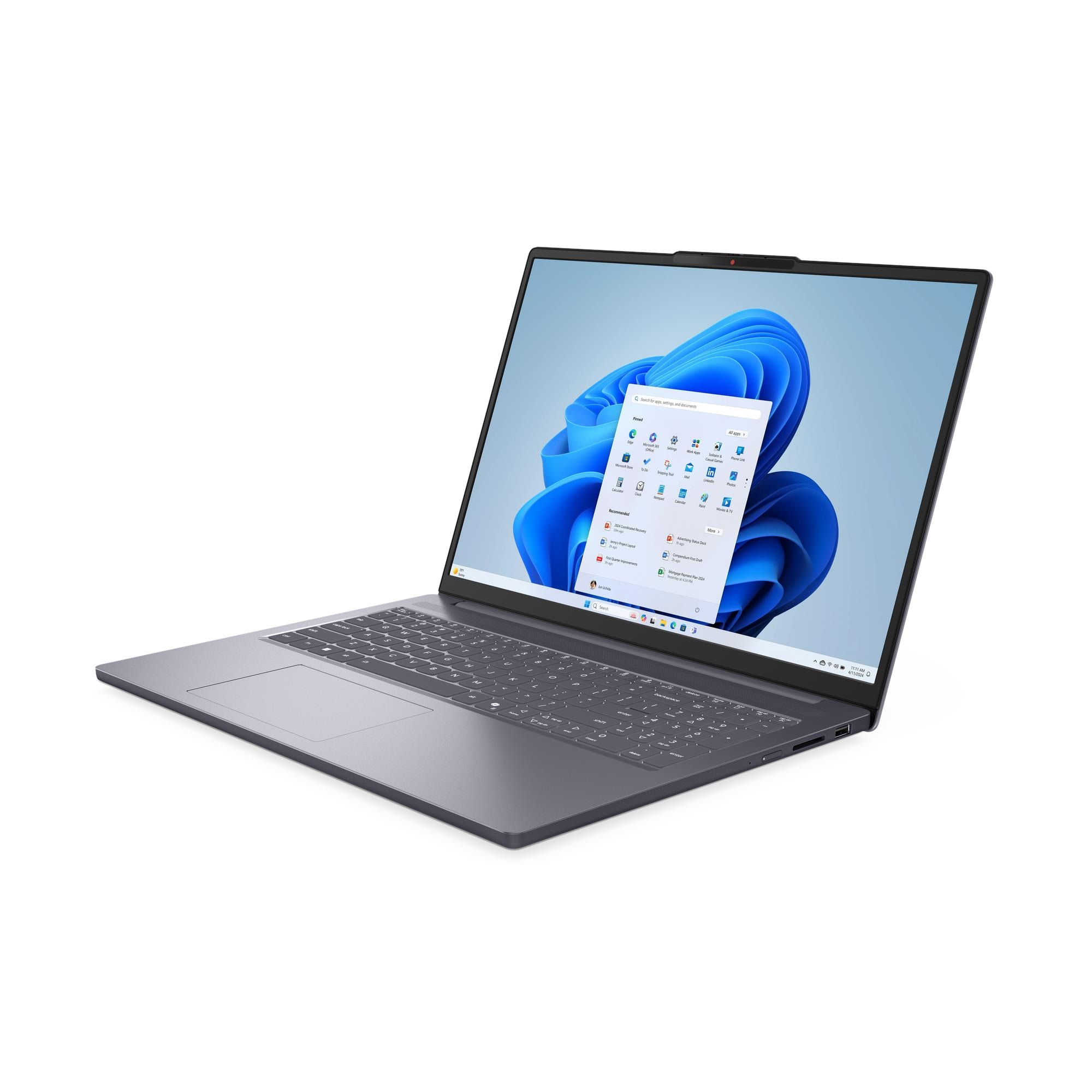 Beyaz arkaplanda gri bir dizüstü bilgisayar, mavi duvar kağıtlı Windows masaüstünü gösteriyor.