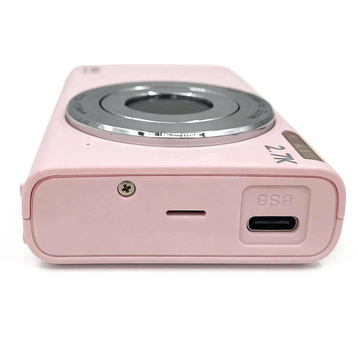 Una fotocamera digitale rosa con porta USB-C visibile in basso, su sfondo bianco.