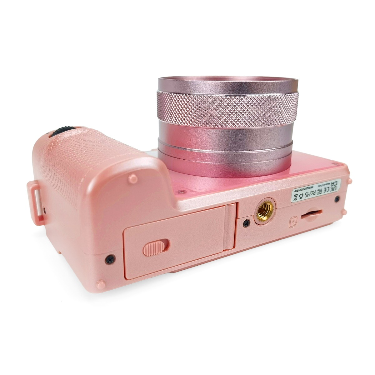 Una fotocamera digitale rosa con un grande obiettivo cilindrico su sfondo bianco.