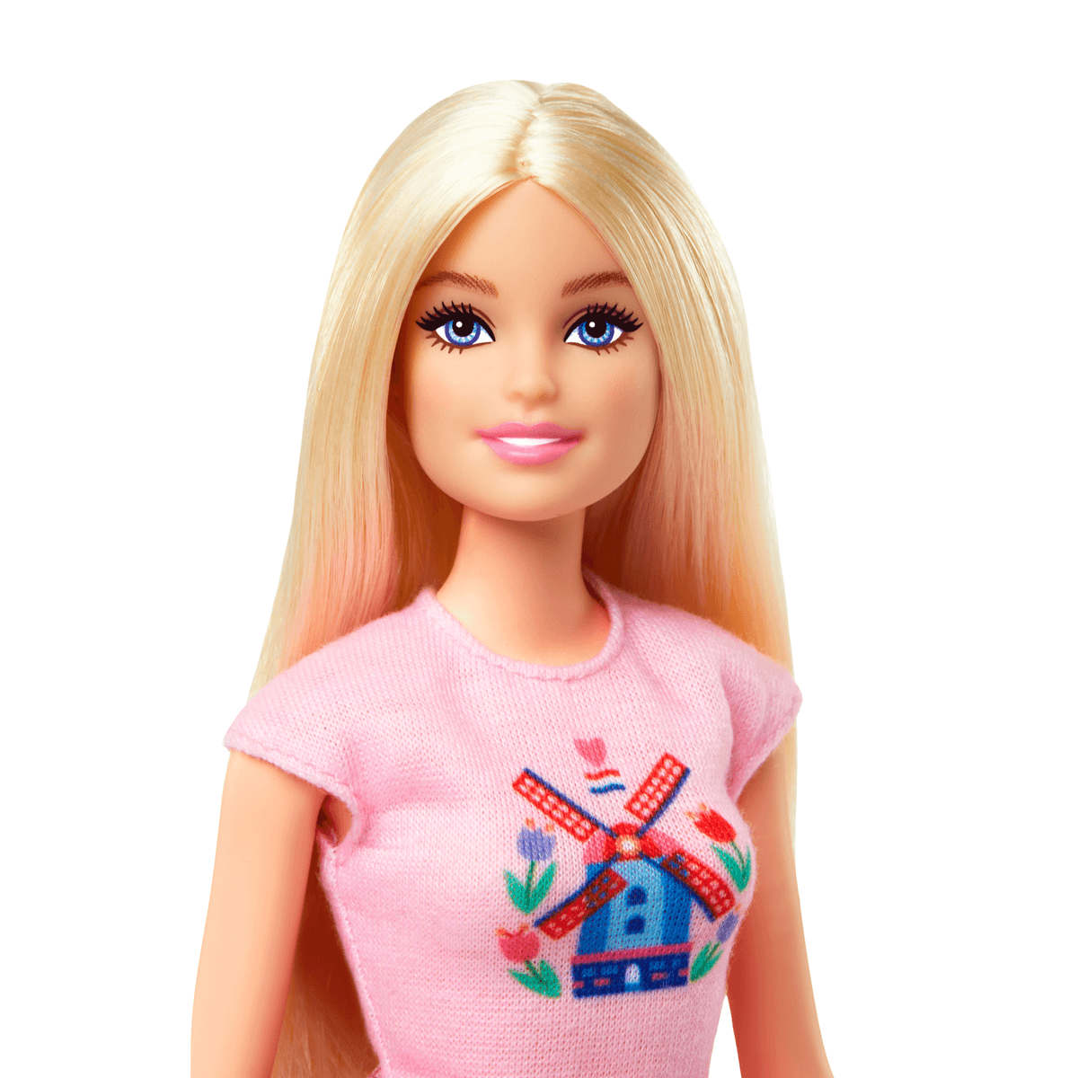 Eine Barbie-Puppe mit langen blonden Haaren, blauen Augen und einem rosafarbenen Oberteil mit Windmühlen-Motiv.