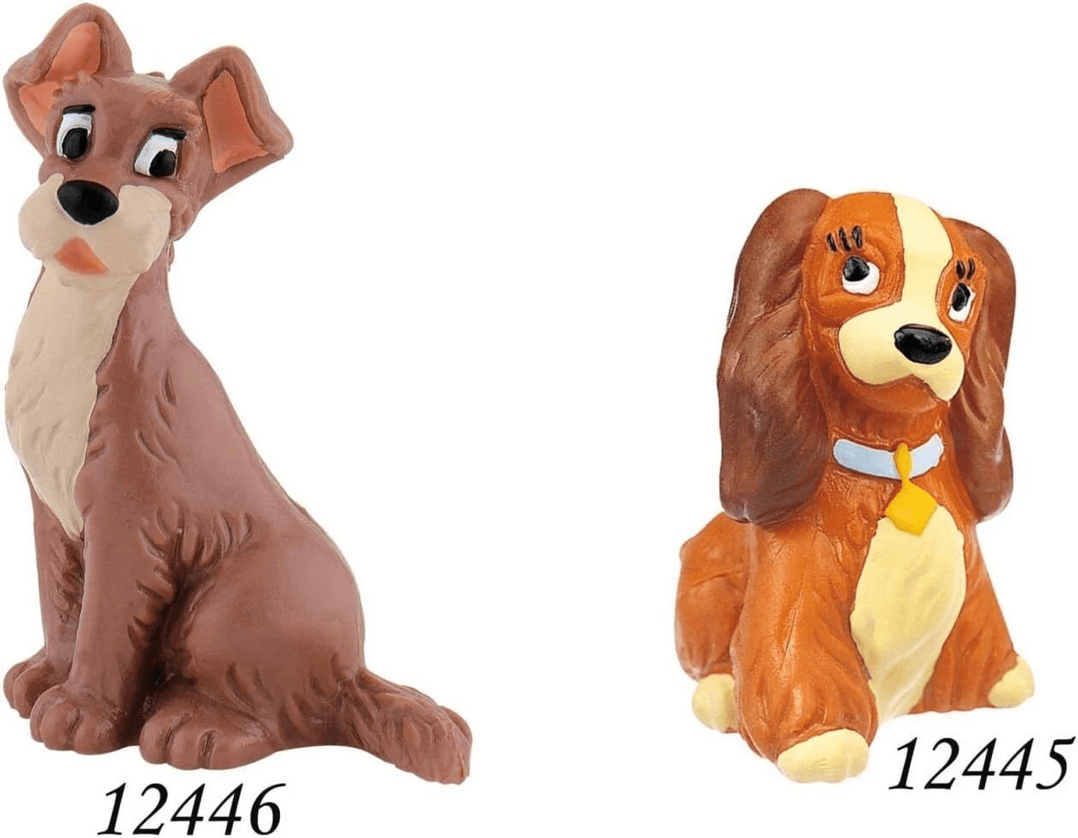 Dos figuras de perros de plástico de La dama y el vagabundo, etiquetadas 12446 y 12445 sobre fondo blanco.