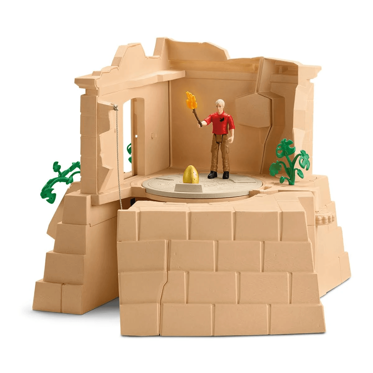 Ein Actionfiguren-Spielset zeigt eine steinerne Ruine mit einer Figur, einer Fackel und einem goldenen Ei.