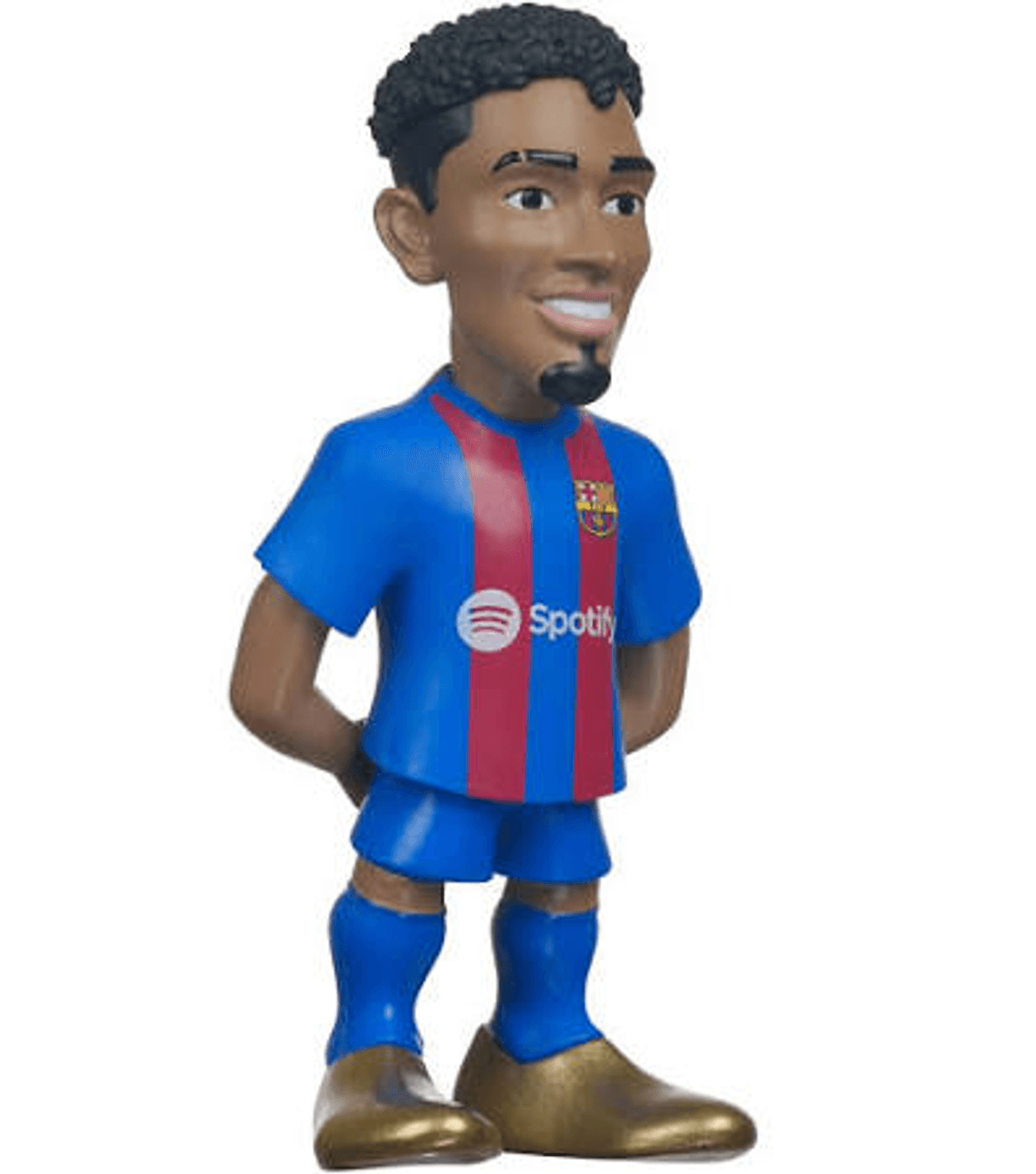Una pequeña figura de fútbol con camiseta azul y roja, pantalones cortos azules, calcetines y zapatos dorados sobre fondo blanco.
