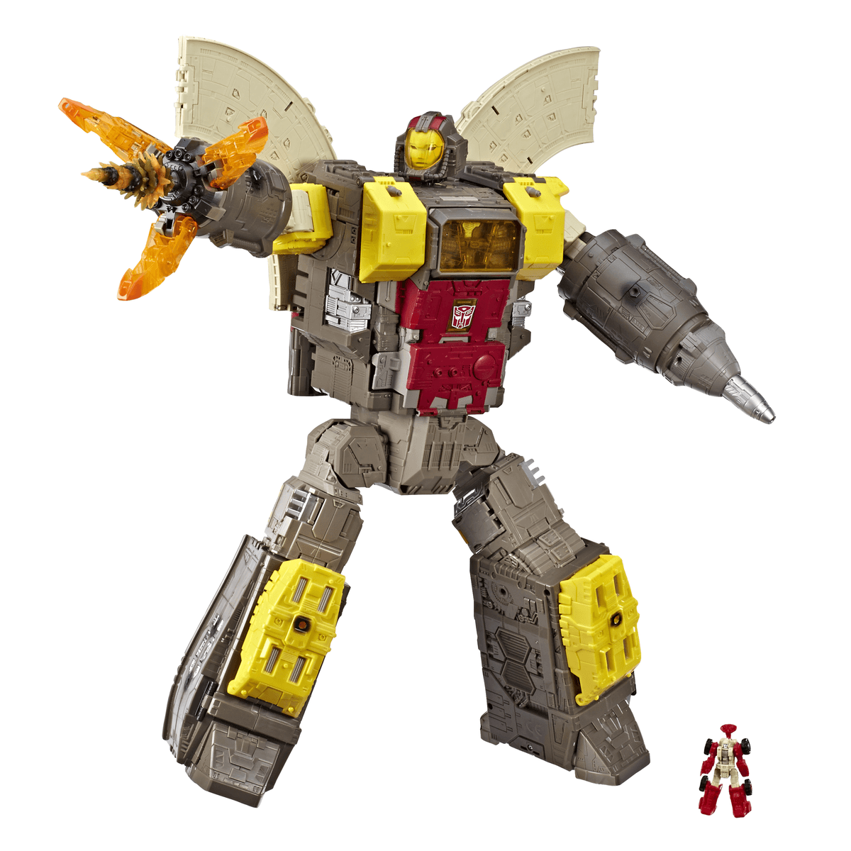Un robot Transformer gris, rojo y amarillo con alas y un brazo de taladro junto a una pequeña figura roja.