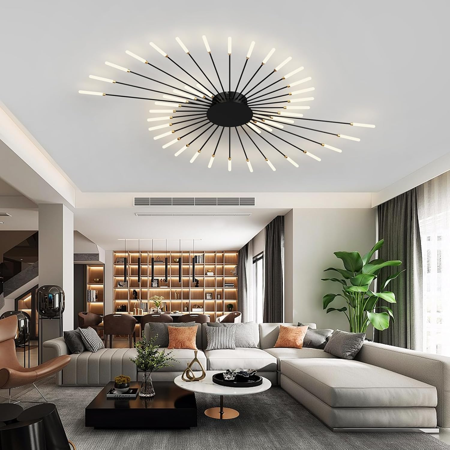 Ein modernes Wohnzimmer mit großem grauen Sofa, Couchtischen und einer einzigartigen spiralförmigen Deckenleuchte.